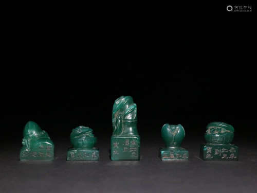A SET OF CHINESE CARVED GREEN STEATITE STONE SEALS