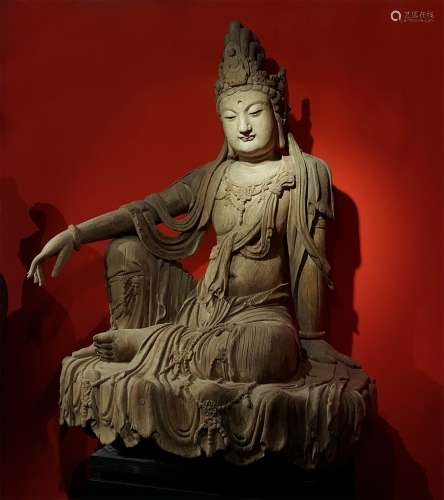 A TANG DYNASTY 
WOODCARVING GUANYIN STATUE