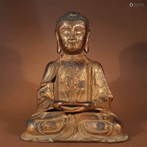 A MING DYNASTY SAKYAMUNI STATUE