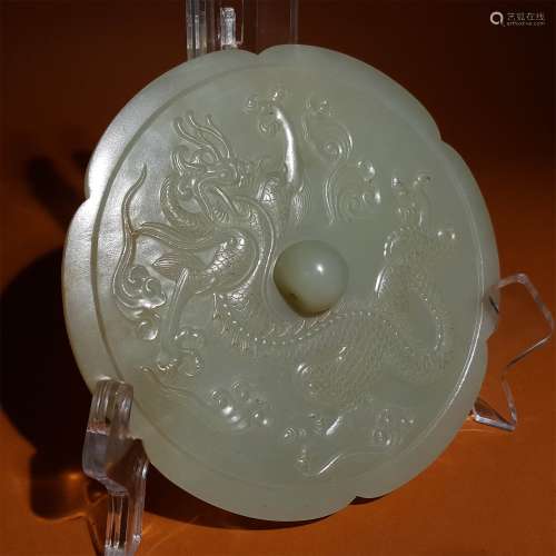 A MING DYNASTY CARVED DRAGON PATTERN JADE MIRROR