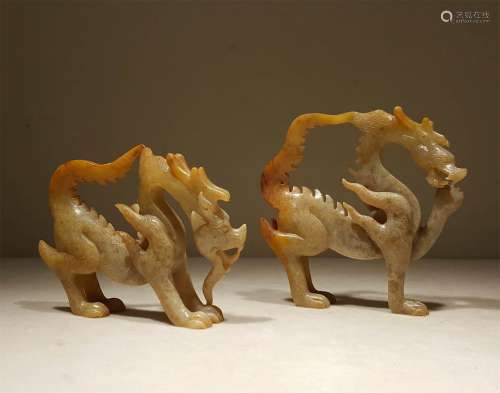 A PAIR OF TANG DYNASTY CARVED JADE DRAGON SHAPE ORNAMENTS