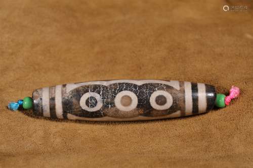 AN ANCIENT SIX EYES PATTERN DZI BEAD