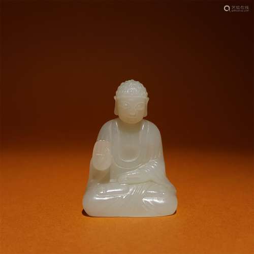 A QING DYNASTY CARVED WHITE JADE 
BUDDHA ORNAMENT