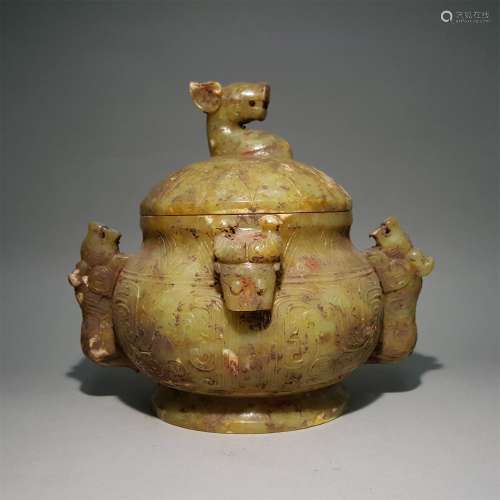 A WARRING STATES PERIOD CARVED YELLOW JADE DRAGON PATTERN CRICKET JAR