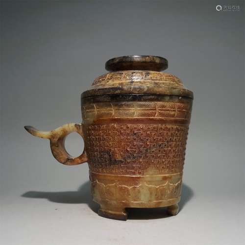 A WARRING STATES PERIOD CARVED JADE CLOUD PATTERN CUP