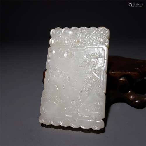 A CHINESE CARVED HETIAN JADE PENDANT