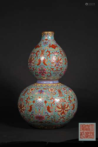 A QING DYNASTY ENAMEL PORCELAIN GOURD SHAPE BOTTLE