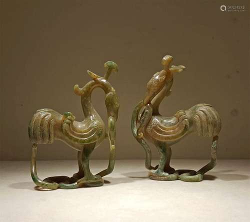 A PAIR OF TANG DYNASTY CARVED BRONZE DIP JADE BIRD ORNAMENTS