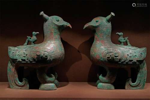 A PAIR OF WARRING STATES PERIOD BRONZE JADE OWLS