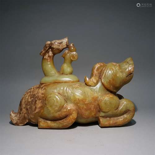 A WARRING STATES PERIOD CARVED COW SHAPE ZUN