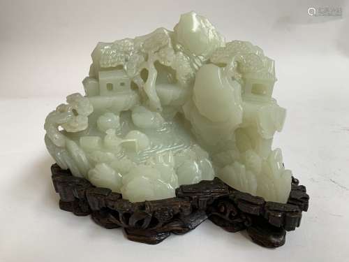 A QING DYNASTY CARVED WHITE JADE ORNAMENT