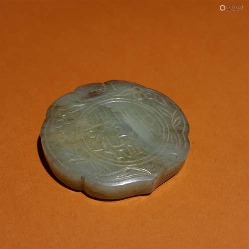 A MING DYNASTY CARVED WHITE JADE PENDANT