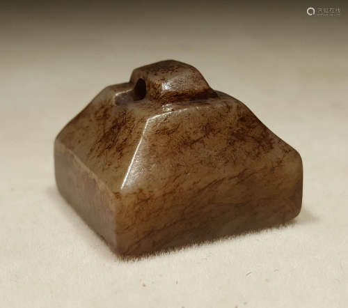 A WARRING STATES PERIOD CARVED JADE SEAL