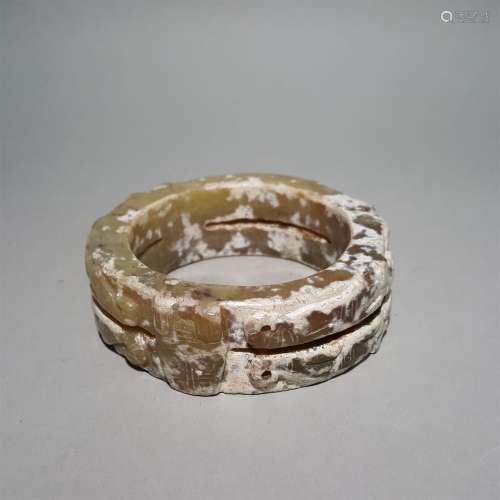 A WARRING STATES PERIOD CARVED JADE DRAGON PATTERN RING