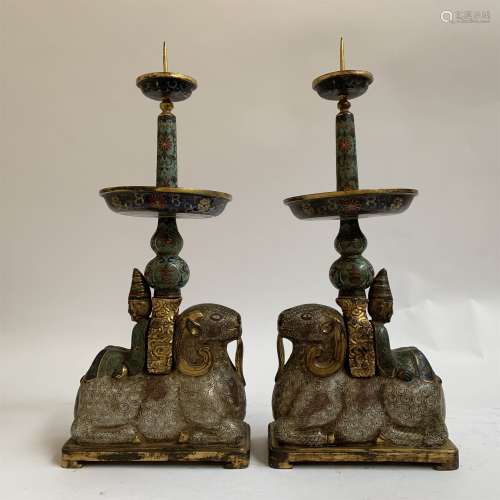 A PAIR OF CLOISONNE SHEEP SHAPE CANDLE HODERS