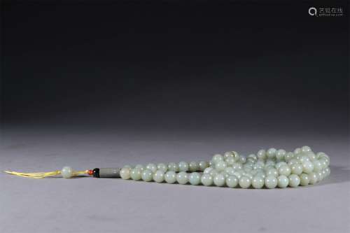 A CHINESE CARVED HETIAN JADE BUDDHA BEADS STRING