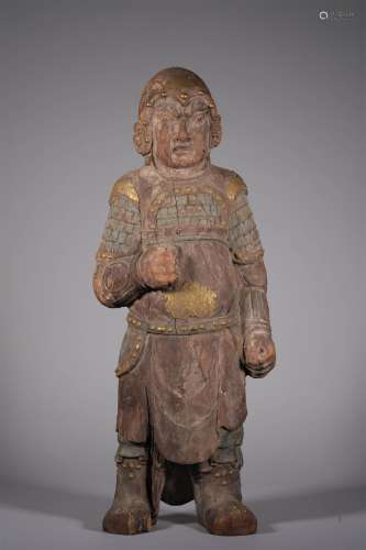 A LIAO DYNASTY CARVED WOOD 
WARRIOR STATUE