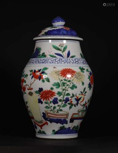 A QING DYNASTY BLUE AND WHITE MULTI COLORED PORCELAIN JAR WITH LID