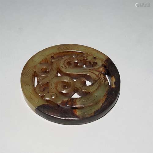 A MING DYNASTY CARVED JADE DRAGON PATTERN PENDANT