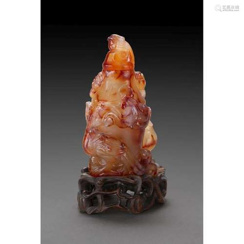 BOTTLE COVERED in carnelian agate, the rim carved …