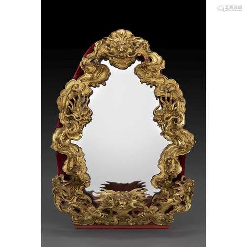 LARGE MIRROR with gilded wooden frame, with carved…