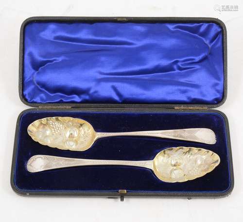 A cased set of George III silver berry spoons with later engraving.