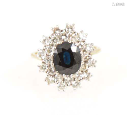 A sapphire and diamond oval cluster ring.