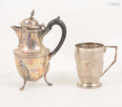 A small silver hot water jug and a sterling silver mug,