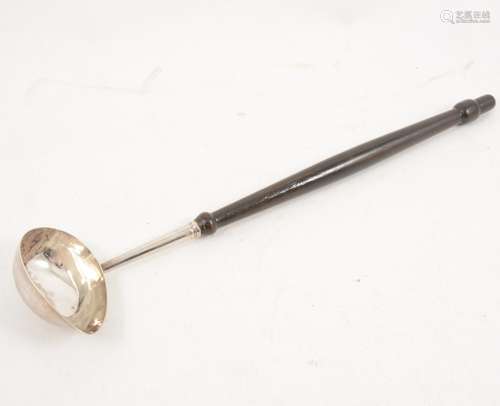 A silver punch ladle with wooden handle.