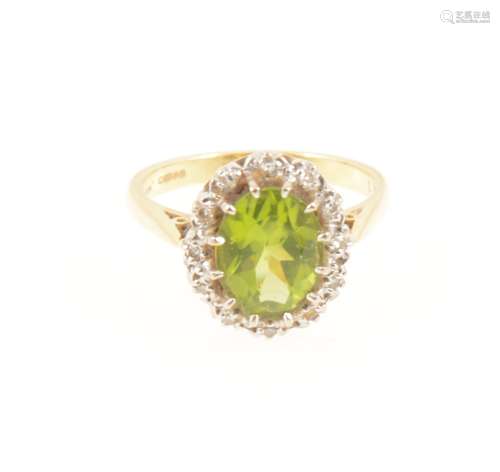 A peridot and diamond oval cluster ring.