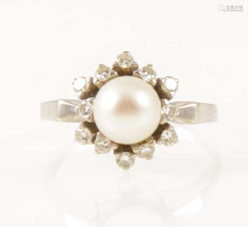 A pearl and diamond circular cluster dress ring.