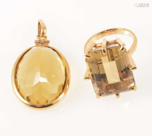 A smoky quartz dress ring and citrine pendant.