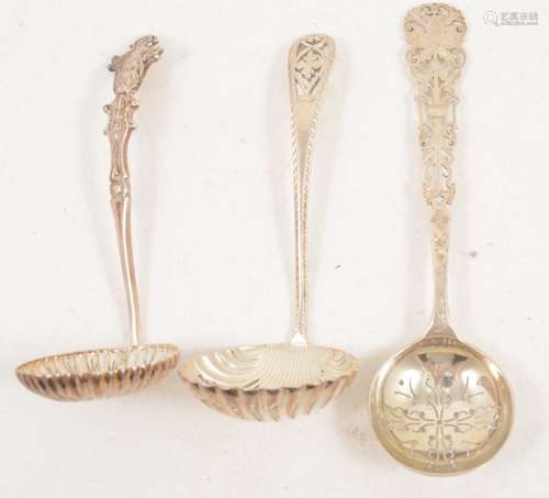 Three ornate silver sugar sifting spoons, Sheffield.