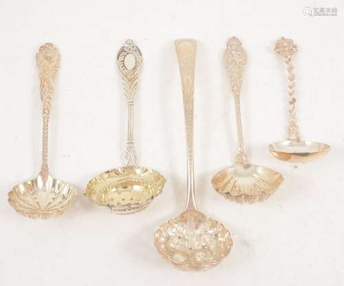 Five ornate silver sugar sifting spoons, London.