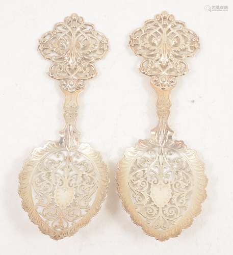 A pair of silver spoons with pierced bowls by Goldsmiths & Silversmiths Co Ltd.