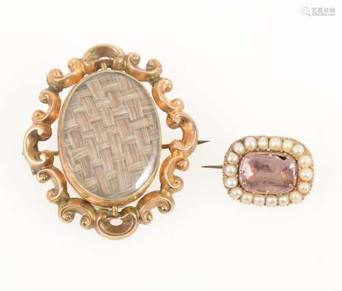 A Victorian mourning swivel brooch and a small pearl brooch (centre stone damaged)