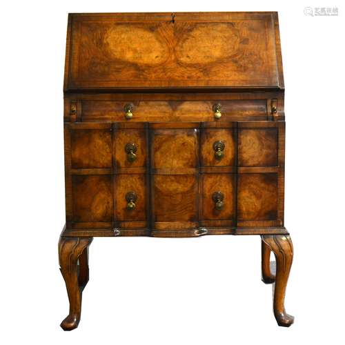 A burr walnut bureau in the Georgian style