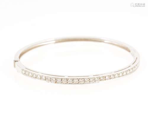 A modern diamond set half hinged bangle