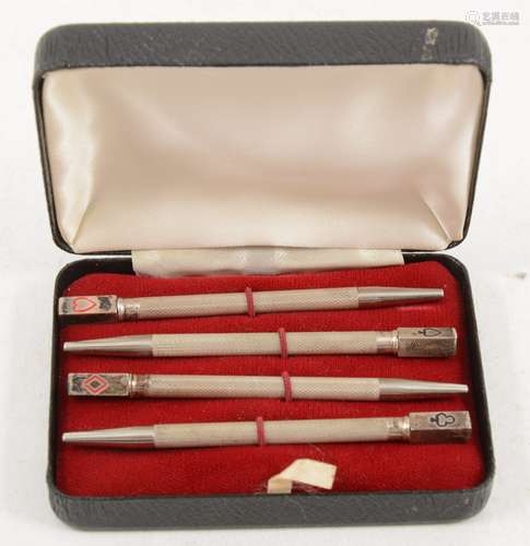 A cased set of silver bridge pencils.