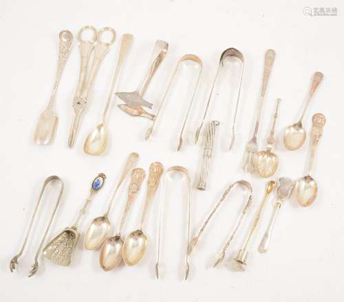 A collection of silver and plated decorative flatware, sugar tongs, grape scissors.