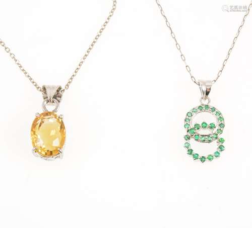 Two pendants and chains, a modern emerald double circle pendant.