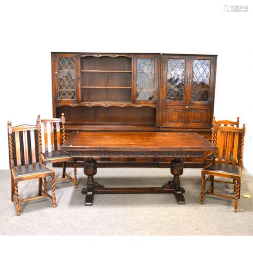 A reproduction stained oak dining room suite