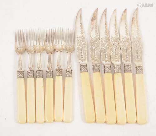 A set of six silver plated dessert knives and forks,