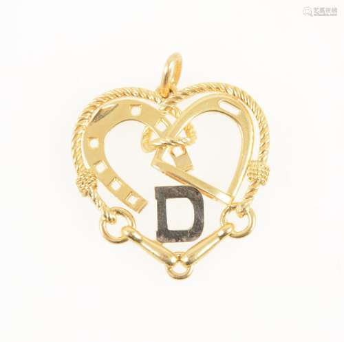 A yellow metal heart shape pendant with equestrian detail.