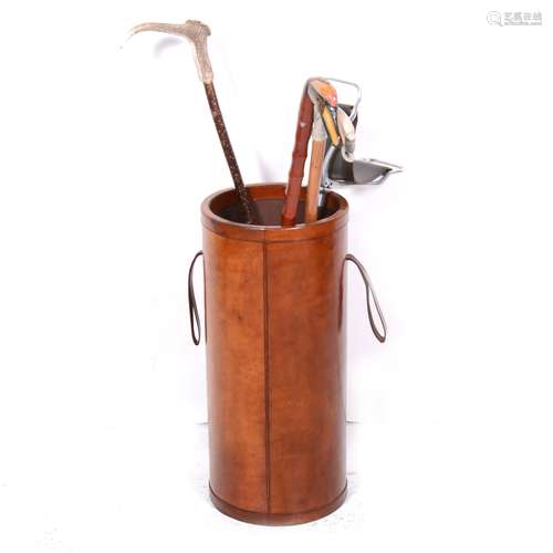 A stitched leather cylindrical stick stand