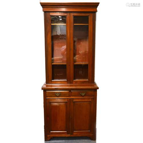 An Edwardian walnut glazed bookcase