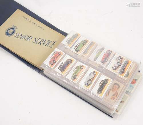 A ring binder album with cigarettes cards