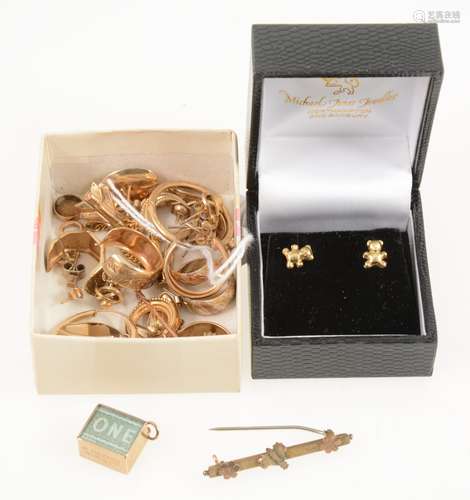 A collection of gold earrings, emergency £1 charm, tie pin, bar brooch, stick pin.