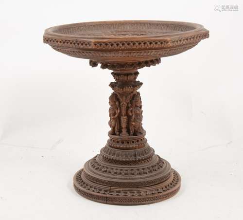 An octagonal carved wood tazza