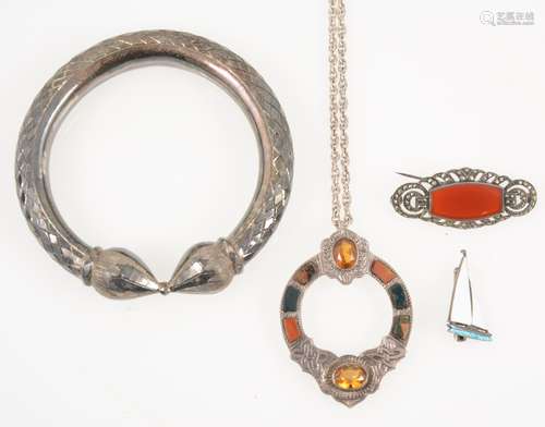 Four items of vintage jewellery, a Scottish pendant, marcasite brooch,